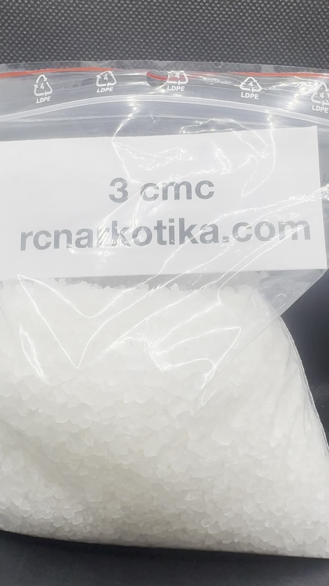 3-CMC crystals with a batch card.